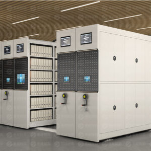 Light grey smart electric mobile shelving system with standard single-section side panel design, featuring dual touchscreen control interface with larger display screen and blue touchscreen panel, with dual-control system including front smart electric interface and rear manual backup crank for intelligent archive storage.